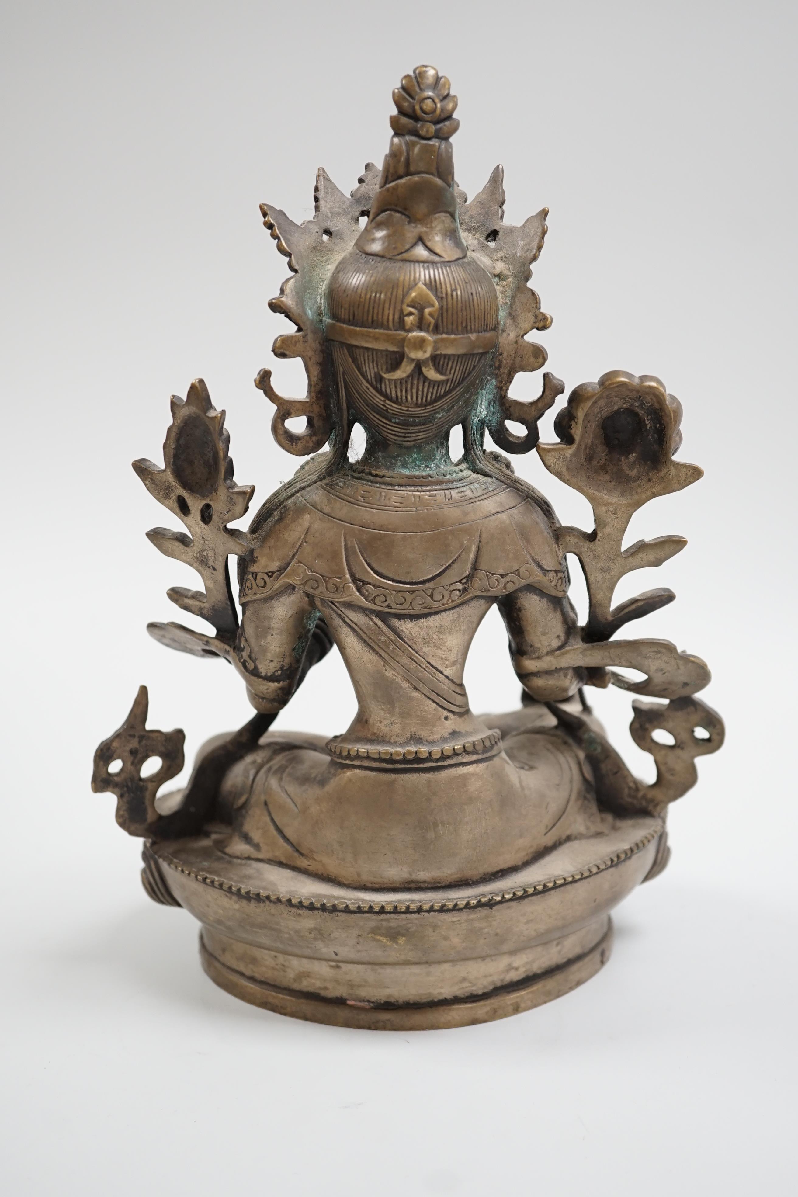 A Himalayan bronze seated figure of Green Tara, 29cm tall